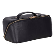 Black full grain leather makeup bag in three-quarter view